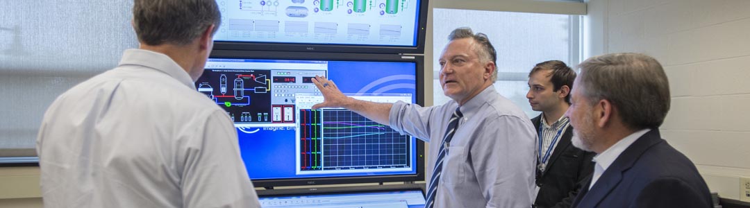 researchers in discussion in the lab