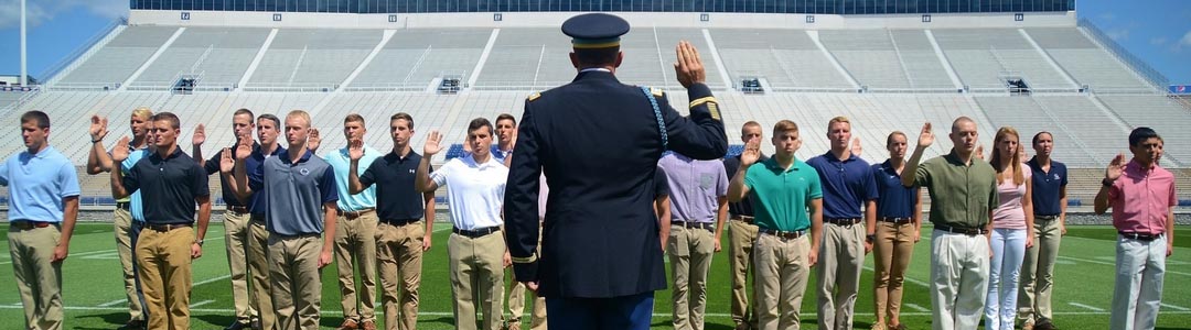 Students in formation taking pledge from military officer